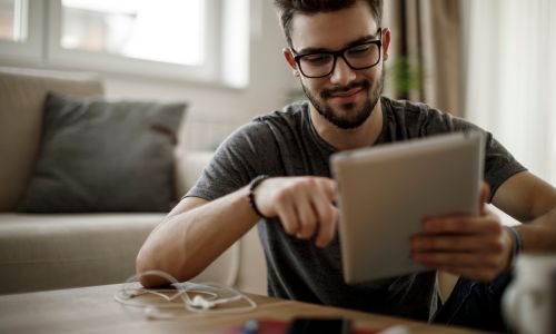 Young man using tablet computer